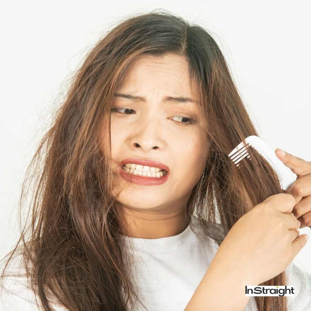 women with dry hair that is one of the signs of heat damaged hair